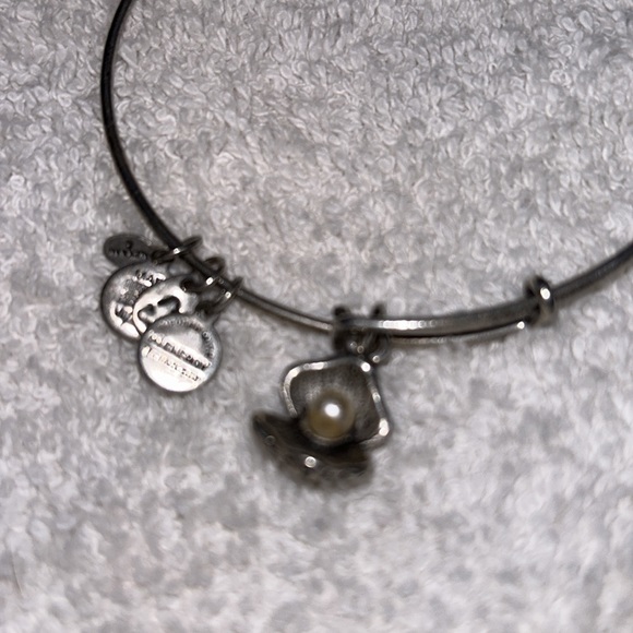Alex and Ani bangle in silver featuring a Pearl in a oyster shell charm. - Picture 3 of 4